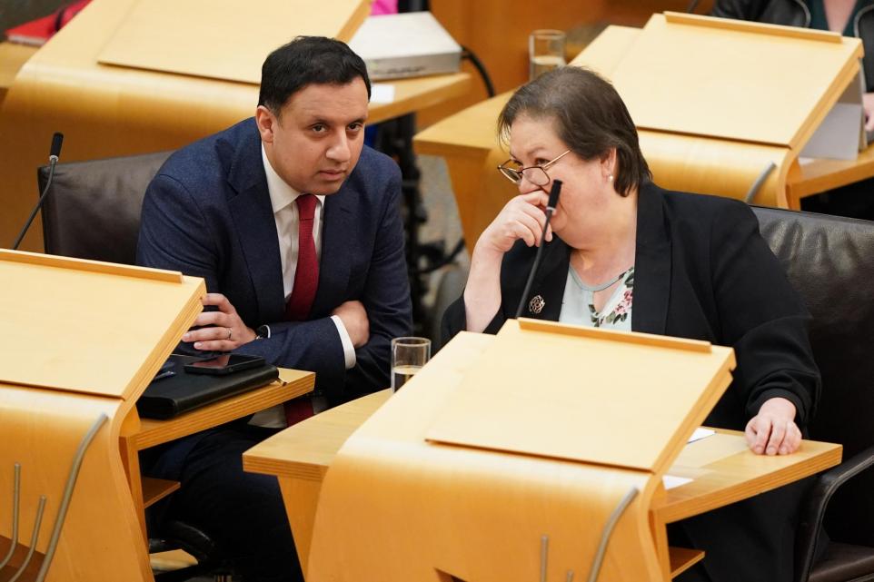 The National: Anas Sarwar conferring with his deputy Jackie Baillie at FMQs