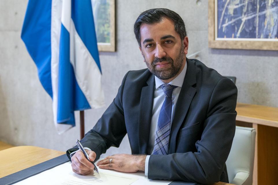 The National: Outgoing First Minister Humza Yousaf signs his official resignation letter to the King (Jane Barlow/PA)