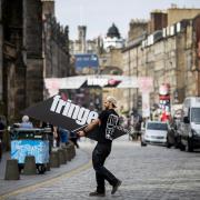 A worker on the Royal Mile during the Edinburgh Festival Fringe