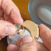 The cost of hearing aid batteries, repairs, adjustments and replacements all add up