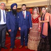 Jagtar Singh Johal and his wife (centre) on their wedding day with his father, brother and sister-in-law. Pic courtesy of the family.