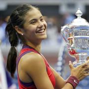 Emma Raducanu holds the trophy as she celebrates winning the women's singles final on day twelve of the US Open