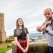 Celebrated fiddler Duncan Chisholm and young local Gaelic singer Anna MacLeod visited Inverness Castle to officially mark the opening day of the National Mòd