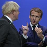 Prime Minister Boris Johnson speaks to French President Emmanuel Macron during COP26. Photo: PA