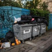 Bins overflowing in Glasgow last year when cleansing workers went on strike/Getty Images