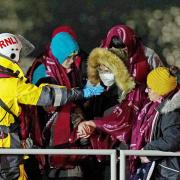 A group of people are brought in to Dover, Kent, by the RNLI, following an incident in which 27 people died in the worst-recorded migrant tragedy in the Channel. Photo: PA