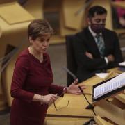 First Minister Nicola Sturgeon with Health Secretary Himza Yousaf pictured in the Holyrood chamber.