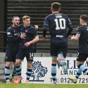 Morton's Gavin Reilly (second from left) celebrates with his team-mates