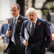 LONDON, ENGLAND - NOVEMBER 10: Britain's Prime Minister Boris Johnson (R) accompanied by his Principal Private Secretary Martin Reynolds (L), return to number 10, Downing Street following the weekly Cabinet meeting at the Foreign Office on November
