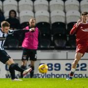 Connor Ronan curls in a wonderful strike, the only goal of the game against Aberdeen
