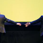 Douglas Ross and Boris Johnson after shaking hands on stage at the Scottish Conservative conference. Photo: PA