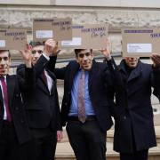 Campaigners dressed as Rishi Sunak protest outside the Treasury office, London, to coincide with the increase in National Insurance Contributions. Photo: PA