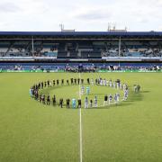 Players from Grenfell AFC and the Emergency Services team observed a minute's silence ahead of a game at the Grenfell Memorial Cup at Kiyan Prince Foundation Stadium in White City, London on May 21