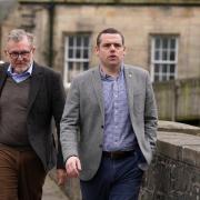 Douglas Ross, right, took over eight hours to make a statement, while numerous colleagues have remained silent