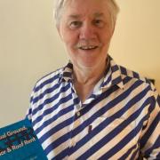 Graeme McCormick with his book on Annual Ground Floor & Roof Rent