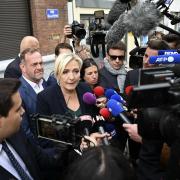 French far-right leader Marine Le Pen addresses reporters in Henin-Beaumont, northern France