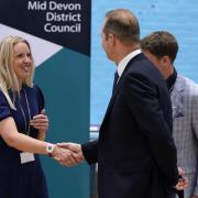 The Liberal Democrats' by-election candidate Richard Foord (right) shakes hands with the Conservative by-election candidate Helen Hurford (left)