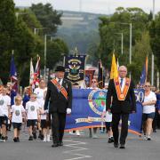 Members of a Protestant loyalist order, Pride of Ardoyne, take part in a Twelfth of July parade in Ardoyne, Belfast. Photograph: PA