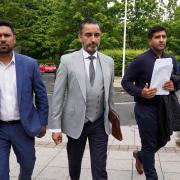 Qasim Sheikh, Aamer Anwar and Majid Haq (left-right) arrive for a press conference at Stirling Court Hotel. Photograph: PA