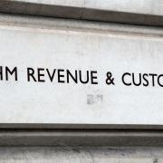 HMRC has apologised after residents of a Midlothian estate were given English tax codes