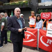 Mick Lynch, general secretary of the RMT, on the picket line outside London Euston train station
