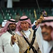 Prince Charles taking part in a traditional sword dance during a visit to Saudi Arabia 
in 2014