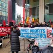 Unite members gathered outside the Scottish Power office in Glasgow to protest energy company profits