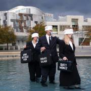 Campaigners protested outside the Scottish Parliament to demand the Scottish Government rethink its approach to the coastline