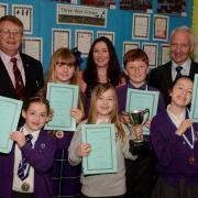 St Palladius primary school pupils that won their Burns competition with past chairman John Hodgart and head teacher Mrs McCallum.