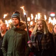 Revellers at the Edinburgh Hogmanay torchlight procession in 2018