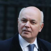 Iain Duncan Smith has told a court he feared for his wife after he was followed by protesters at the Tory party conference last year