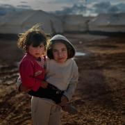 Syrian refugee children play in the Za’atari refugee camp on January 31, 2013