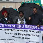 The sister of Sheku Bayoh, Kadi Johnston (centre) and human rights lawyer Aamer Anwar (right) during an anti-racism march in Glasgow