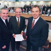 Prime Minister Tony Blair (right), US Senator George Mitchell (centre) and Irish Prime Minister Bertie Ahern after they signed the Good Friday peace agreement