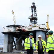 Rishi Sunak (second left) and Scottish Secretary Alister Jack (second right) during a visit to the Port of Cromarty Firth (Image: Russell Cheyne)