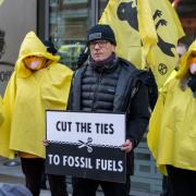 An Extinction Rebellion protester outside Michael Gove's office calls for the UK Government to scrap its plans for a new coal mine