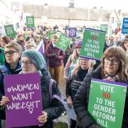 Supporters of the For Women Scotland and the Scottish Feminist Network campaign groups take part in a demonstration outside the Scottish Parliament in December 2022