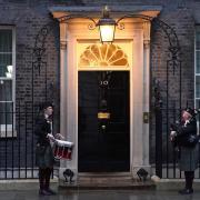 A drummer and a bagpiper outside 10 Downing Street before a Burns Night reception hosted by Rishi Sunak