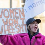 Supporters of the For Women Scotland and the Scottish Feminist Network take part in a demonstration outside the Scottish Parliament