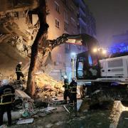 Emergency services at the scene of a collapsed building in Sanliurfa, Turkey, after a 7.8 magnitude earthquake