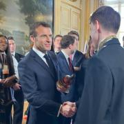 Archippus Sturrock shakes hands with French President Emmanuel Macron