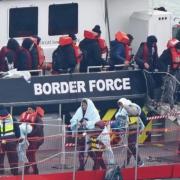Asylum seekers are to be housed in barges and military bases