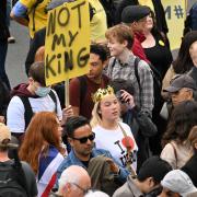 A protestor holds up a placard reading 'Not My King' in Trafalgar Square in London ahead of the coronation of King Charles III and Queen Camilla