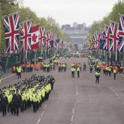 Metropolitan Police officers march along The Mall in London.