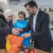 First Minister Humza Yousaf helps out at the Whitfield Community Larder in Dundee
