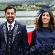 Humza Yousaf and his wife Nadia El-Nakla leave Westminster Abbey following the coronation of King Charles