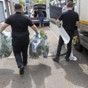Police officers following a cannabis raid in Scotland