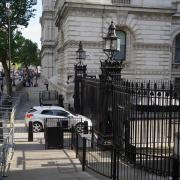 The scene after a car collided with the gates of Downing Street in London