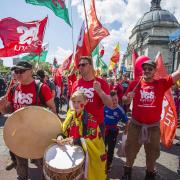Yes Cymru  supporters march through Cardiff