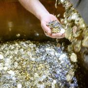 Pound coins roll off the production line at the Royal Mint